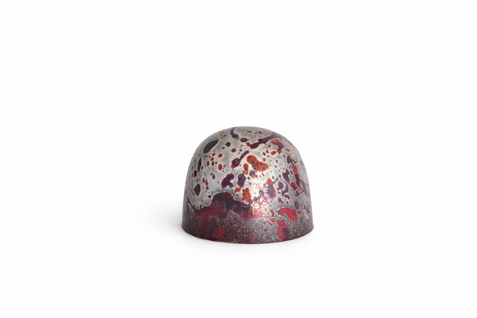 Dark Cherry Liqueur chocolate bonbon with silver and cherry red speckled finish