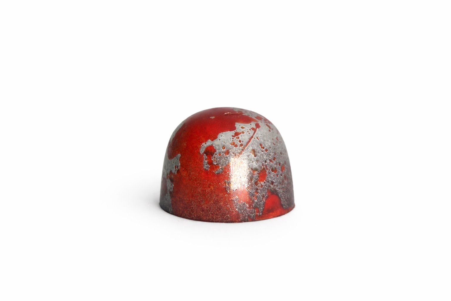 Dark Chilli chocolate bonbon with red and silver speckled finish