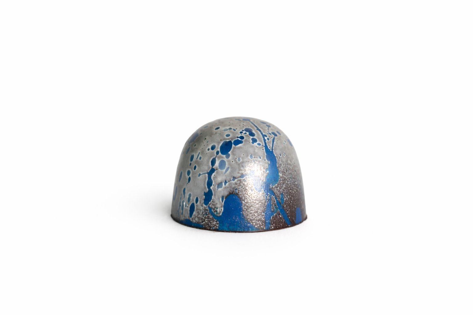 Dark Sea Salt chocolate bonbon with blue and silver speckled finish