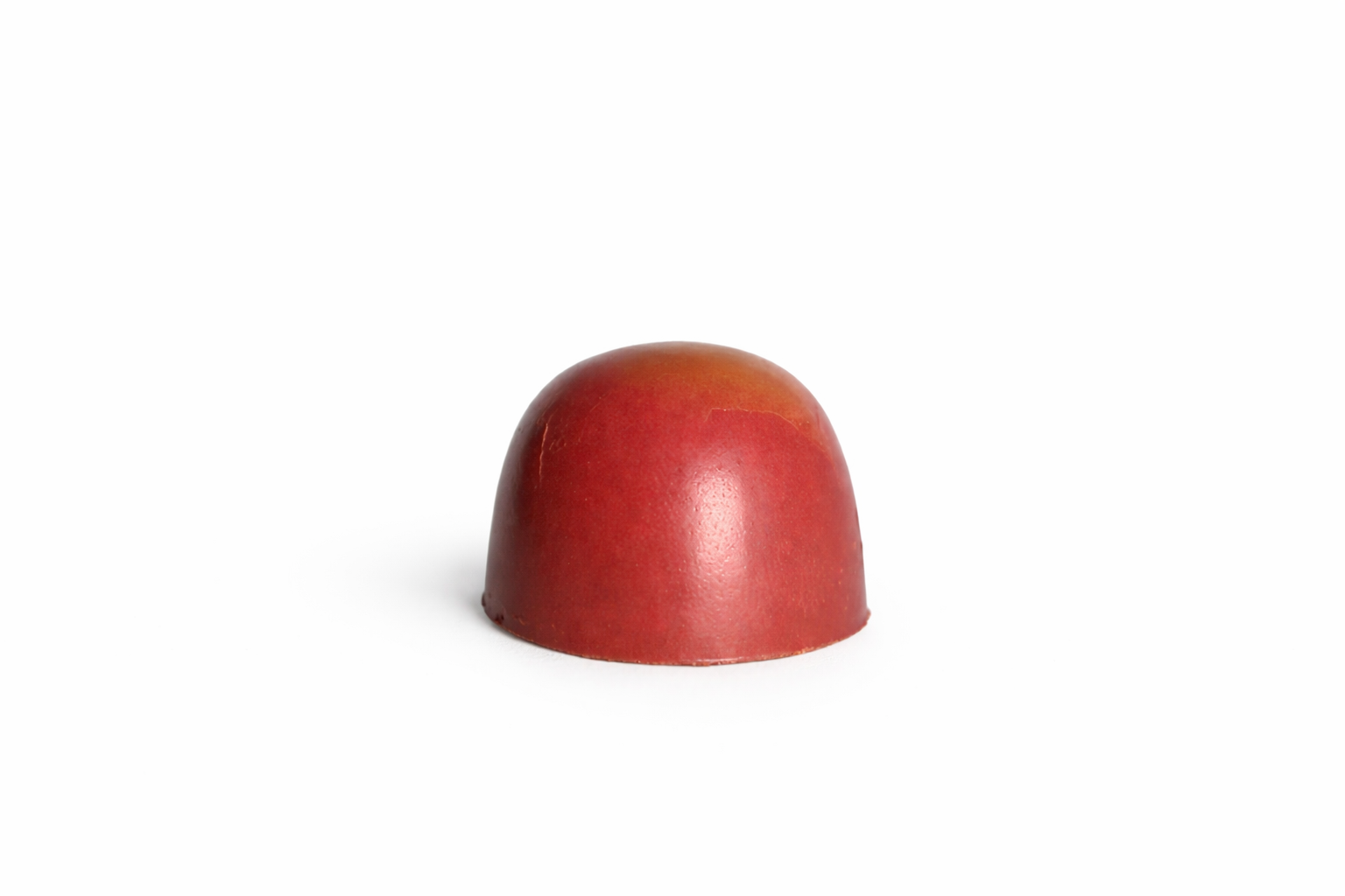 Milk Amarula chocolate bonbon with deep red finish