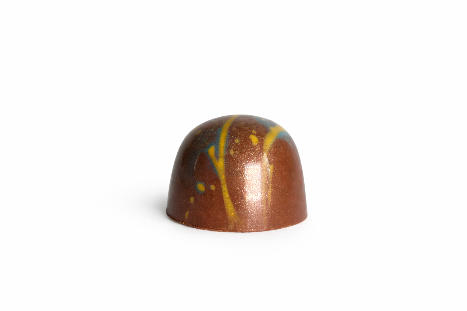 Milk Caramel chocolate bonbon with bronze and white speckled finish