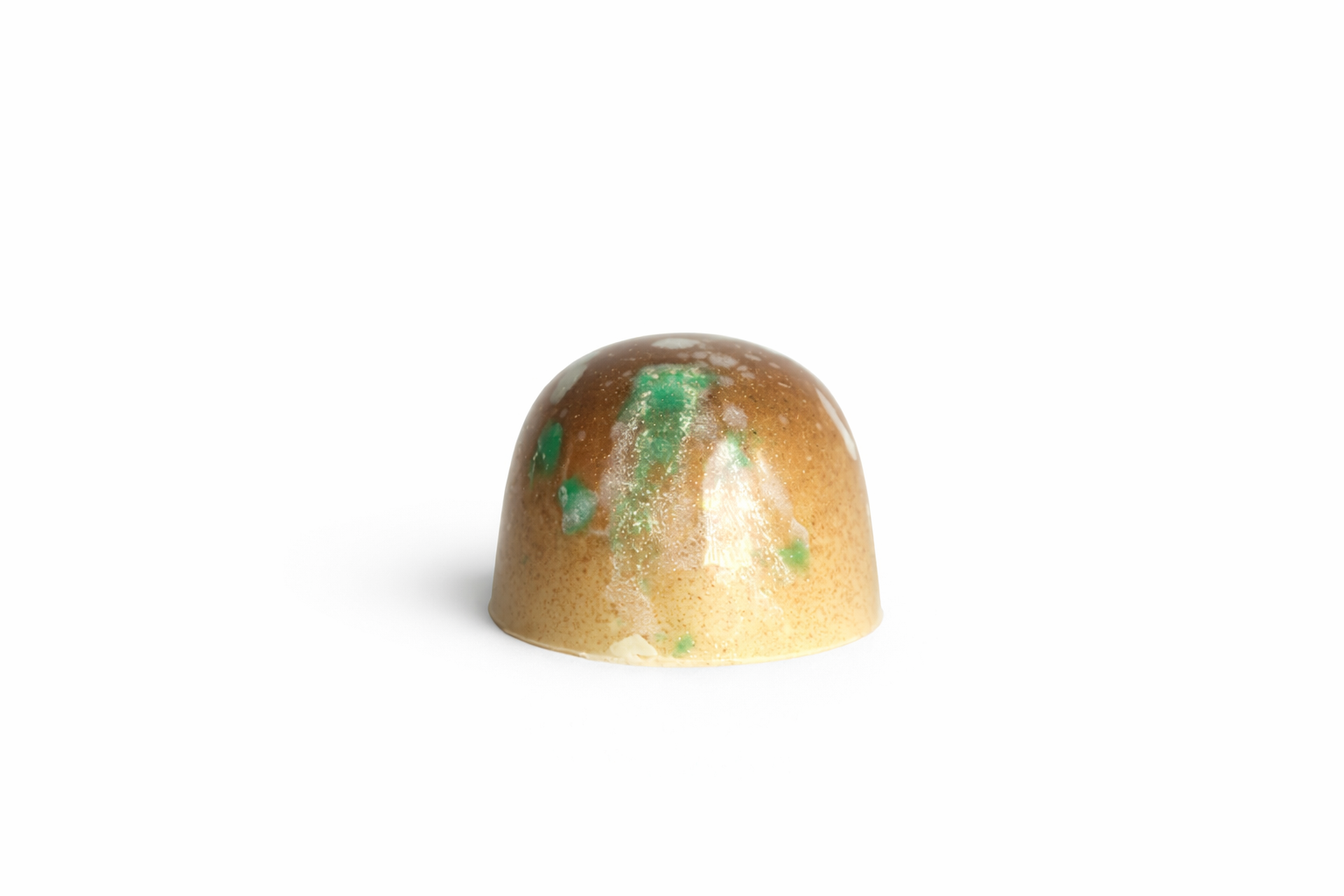 White Coconut chocolate bonbon with golden and green speckled finish