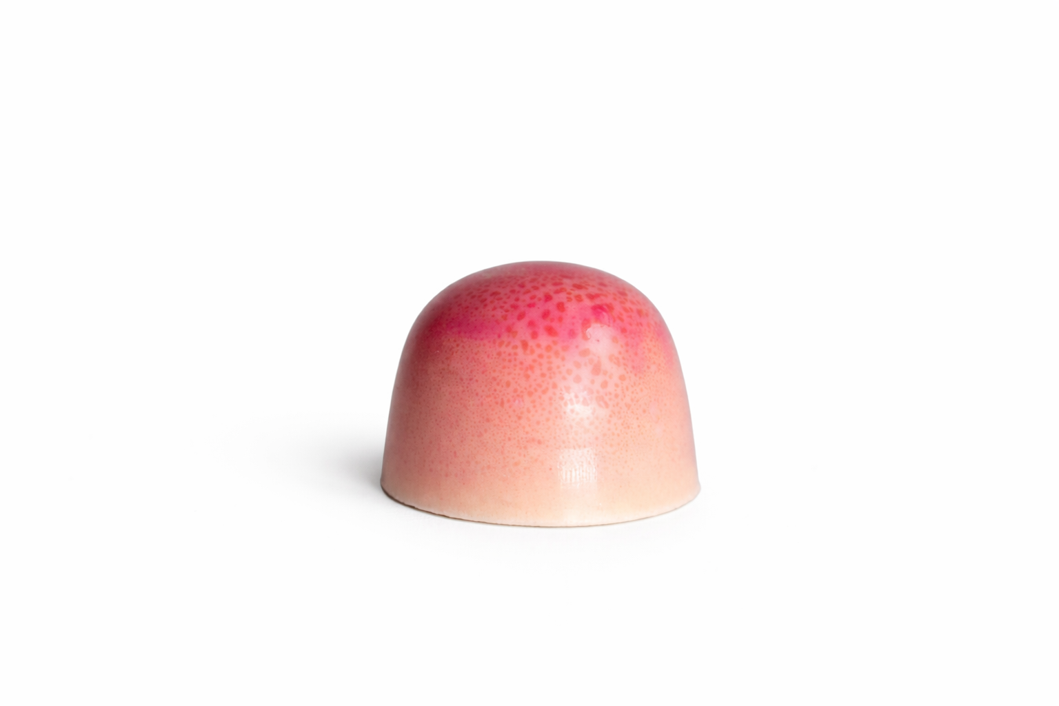 White Strawberry chocolate bonbon with pink gradient finish